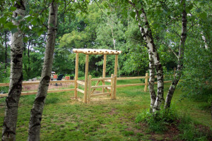 2 rail cedar post and rail fence with wire mesh for animal enclosure includes custom arbor and gate