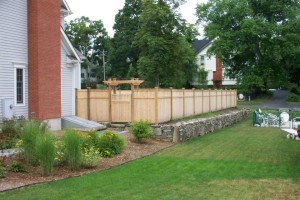 Custom cedar privacy fence with pergola and gate