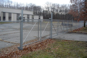 galvanized chain link fence with 16' cantilever gate opening and nylon rollers for gate